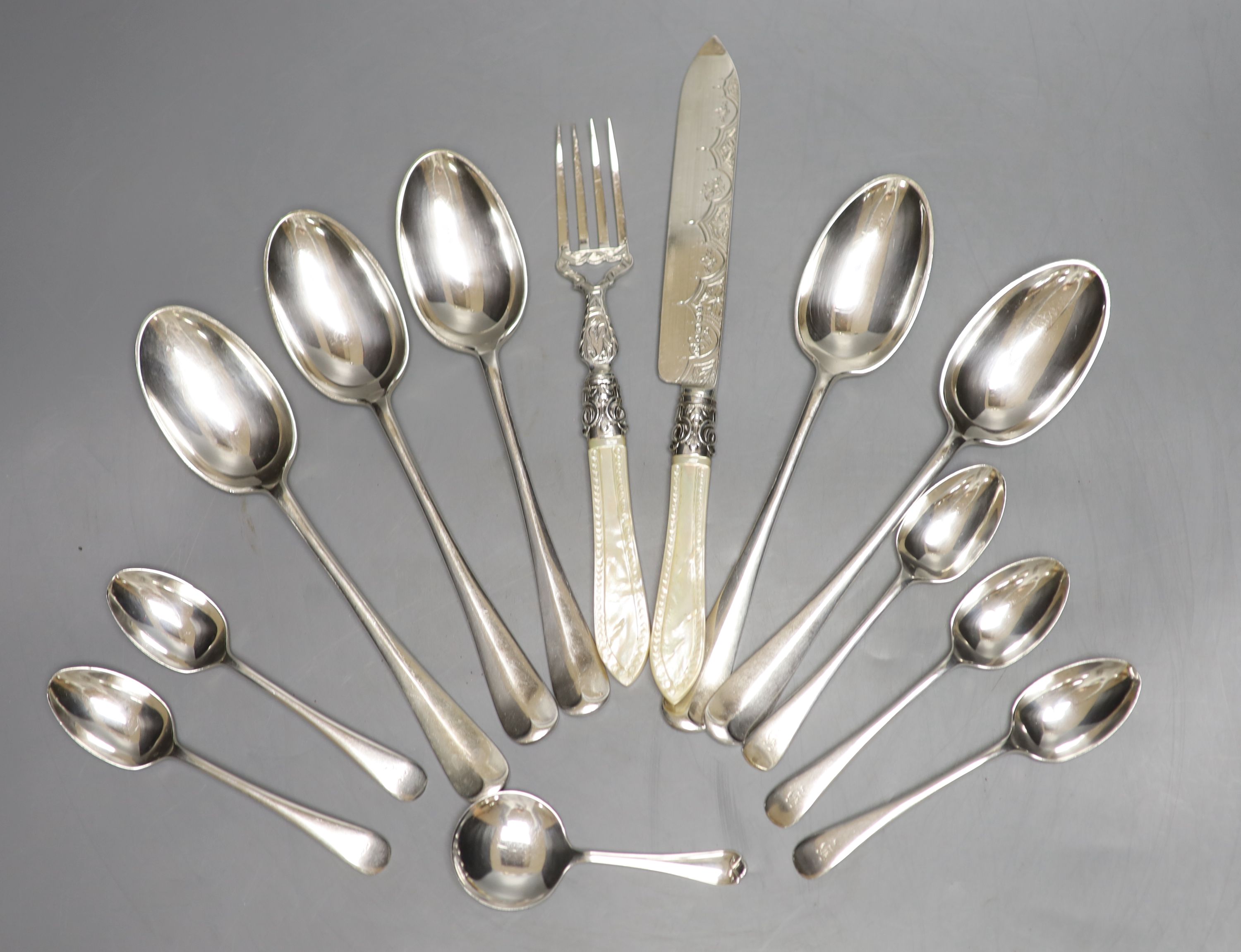 A Victorian mother of pearl handled silver knife and fork, George Unite, Birmingham, 1868, caddy spoon. etc.